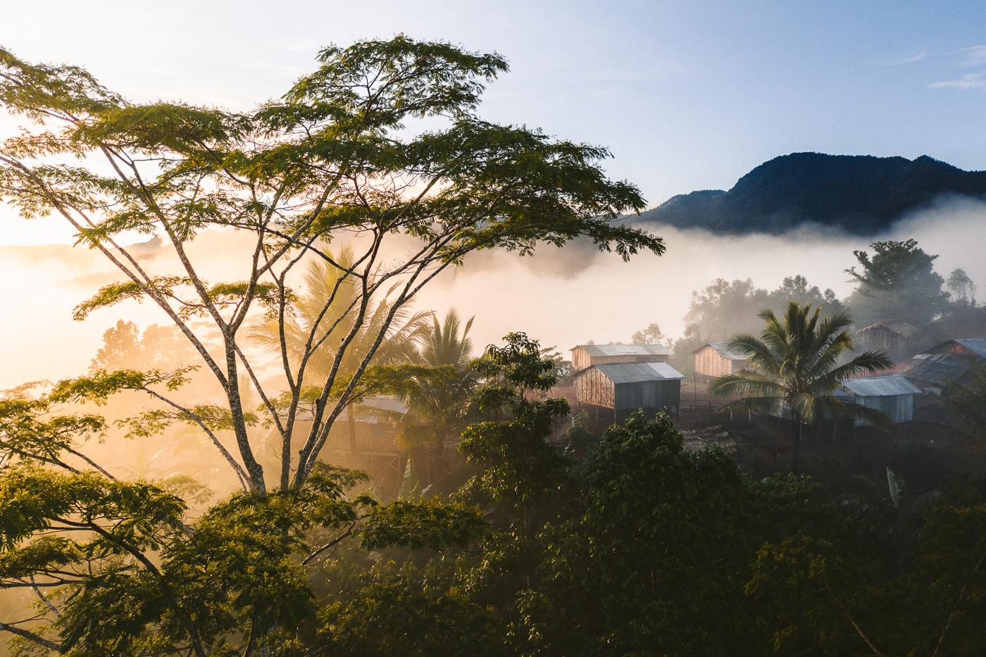 a view of a small town in the mountains.