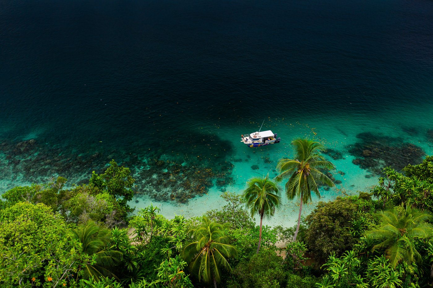 a boat floating on top of a body of water.