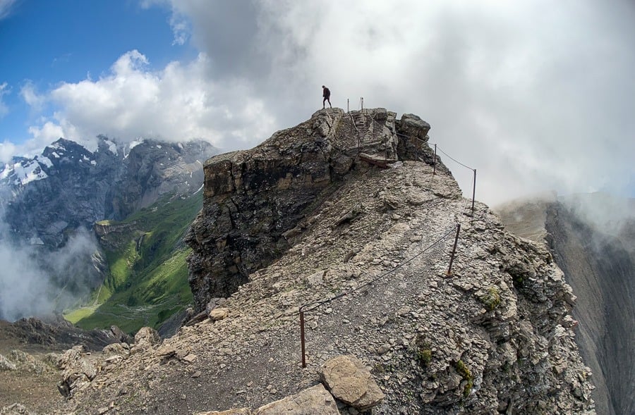 a person standing on top of a mountain.