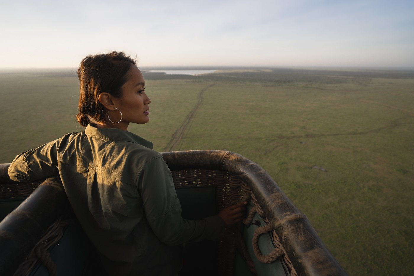 a woman sitting in the back of a truck.